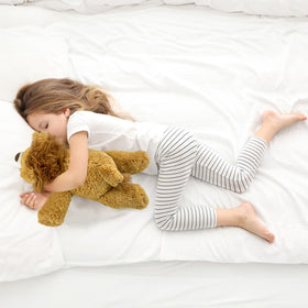 YOUBLEK yellow lion tummy-and-legs weight distribution close-up, realistic cuddle feel