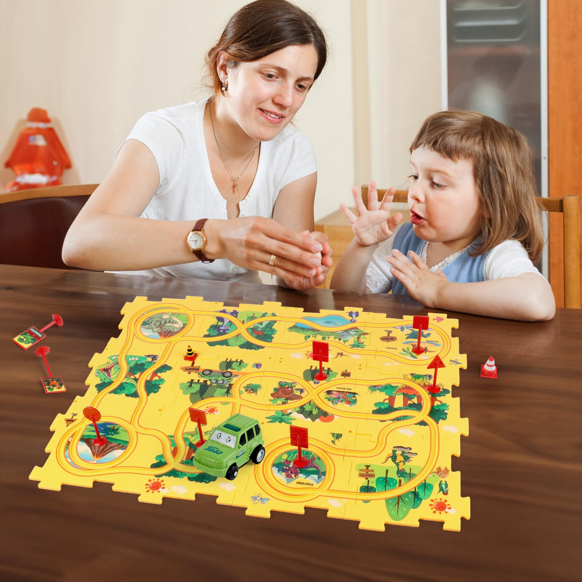 YOOYID green car on track demonstrates cause-and-effect during play.