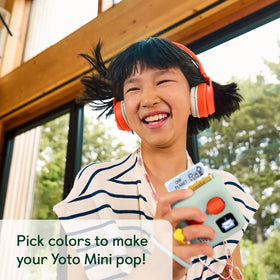 Yoto Mini wrist lanyard keeps the device easy for kids to carry.