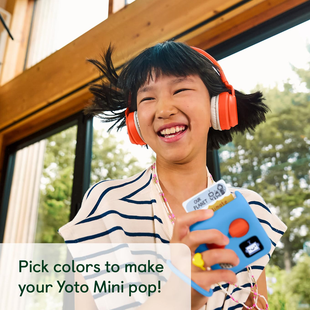 Yoto Mini wrist-lanyard provides quick, secure handling for kids on the go.