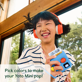 Yoto Mini wrist-lanyard provides quick, secure handling for kids on the go.