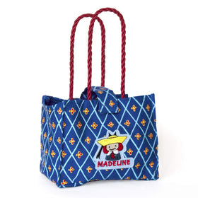 YOTTOY Genevieve tote with Velcro closure keeps plush secure during travel.
