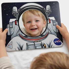 Young Supporters toddler holds the mirror for on-the-go playtime.