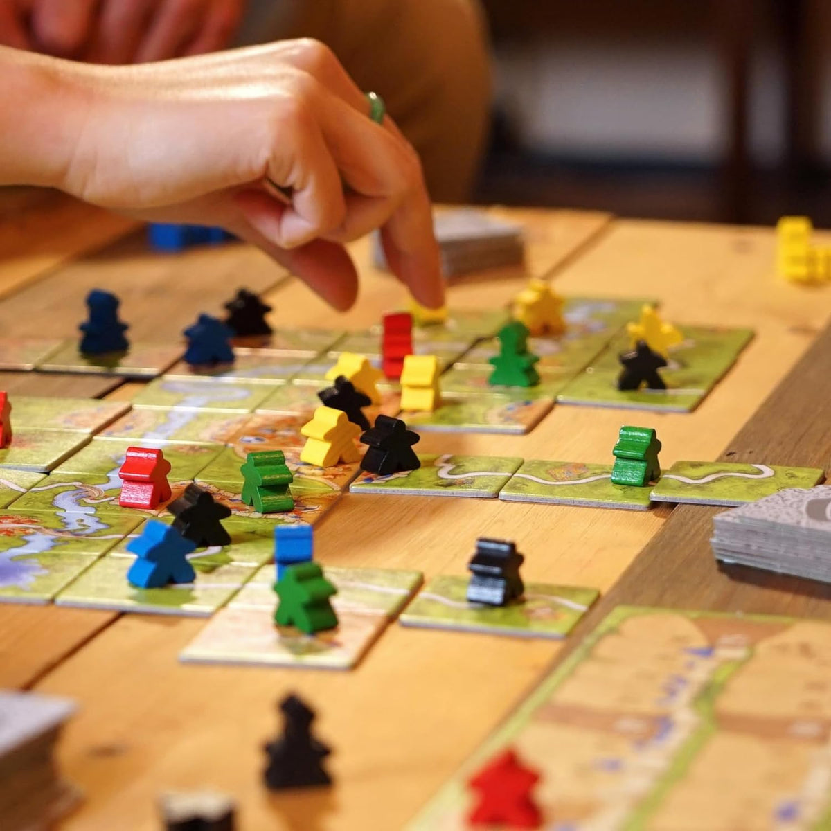 Z-Man Games Carcassonne river expansion image signaling new map variety.