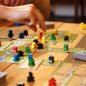 Z-Man Games Carcassonne river expansion image signaling new map variety.