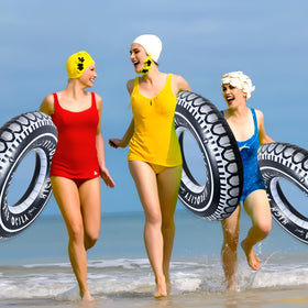 Zaruatu summer pool party buoyant tire float as a festive centerpiece and buoy.