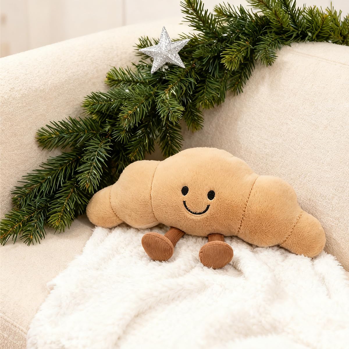 Zaxqerm croissant plush, front view, cozy companion for kids and decor.