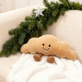 Zaxqerm croissant plush, front view, cozy companion for kids and decor.