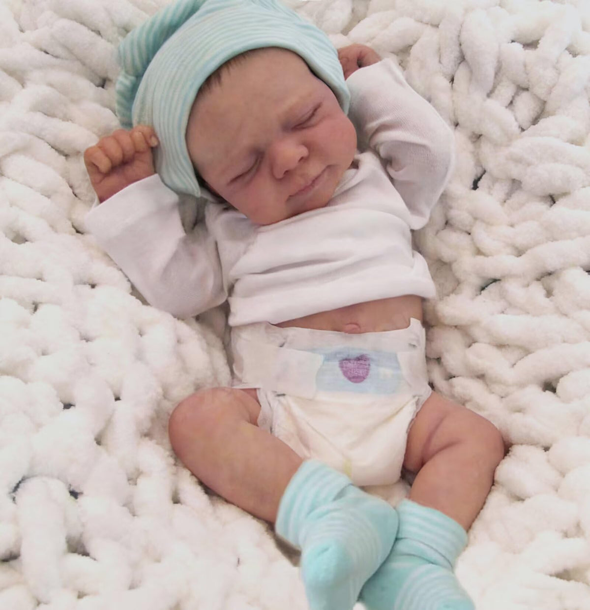 Zero Pam posed baby doll limbs flex for sit or lie scenarios.