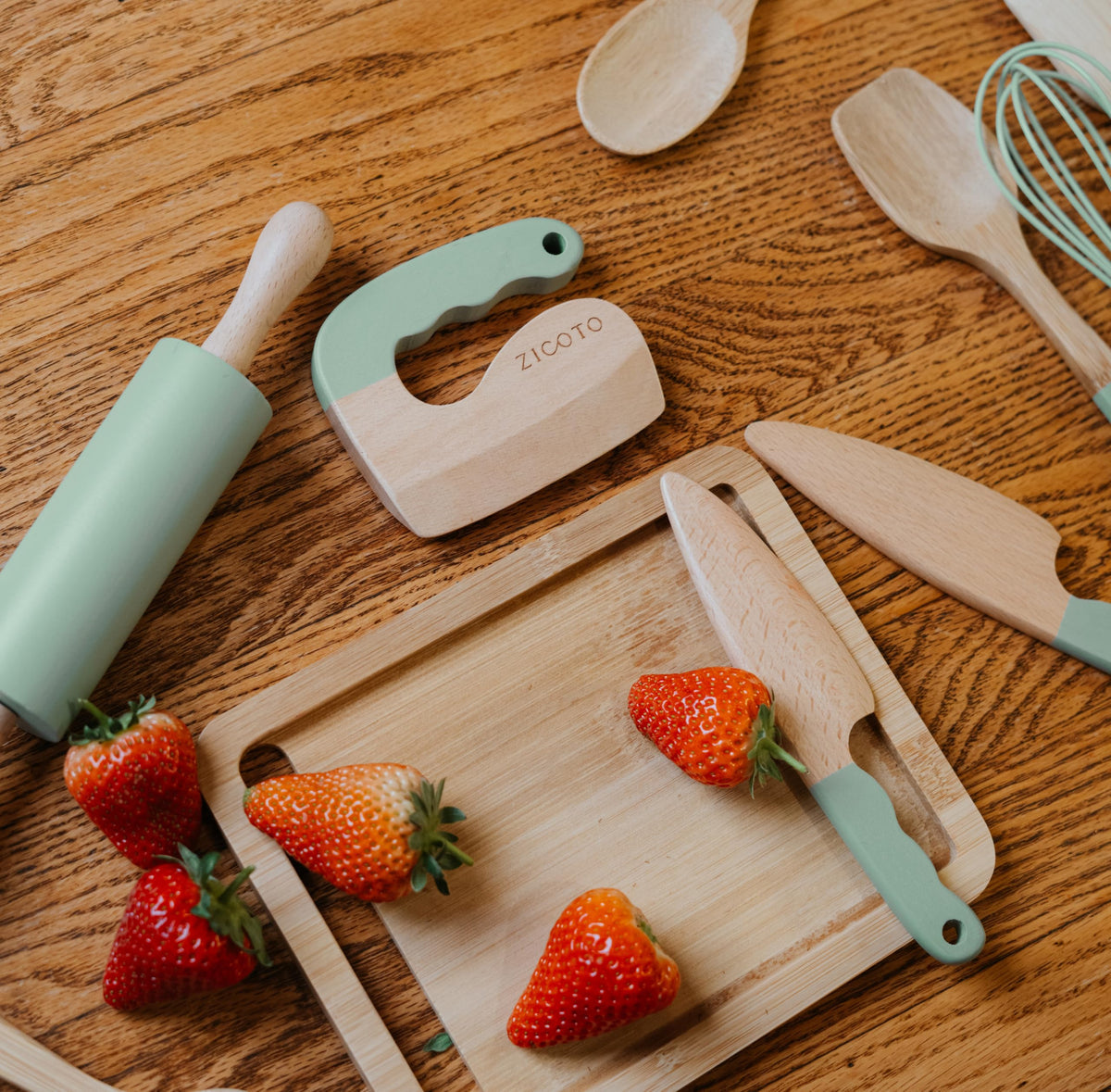 ZICOTO wooden cutting board offers a sturdy surface for tiny hands to prep