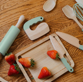 ZICOTO wooden cutting board offers a sturdy surface for tiny hands to prep