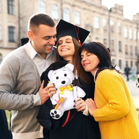 Zomiboo bear with gold tassels accenting the graduation theme.