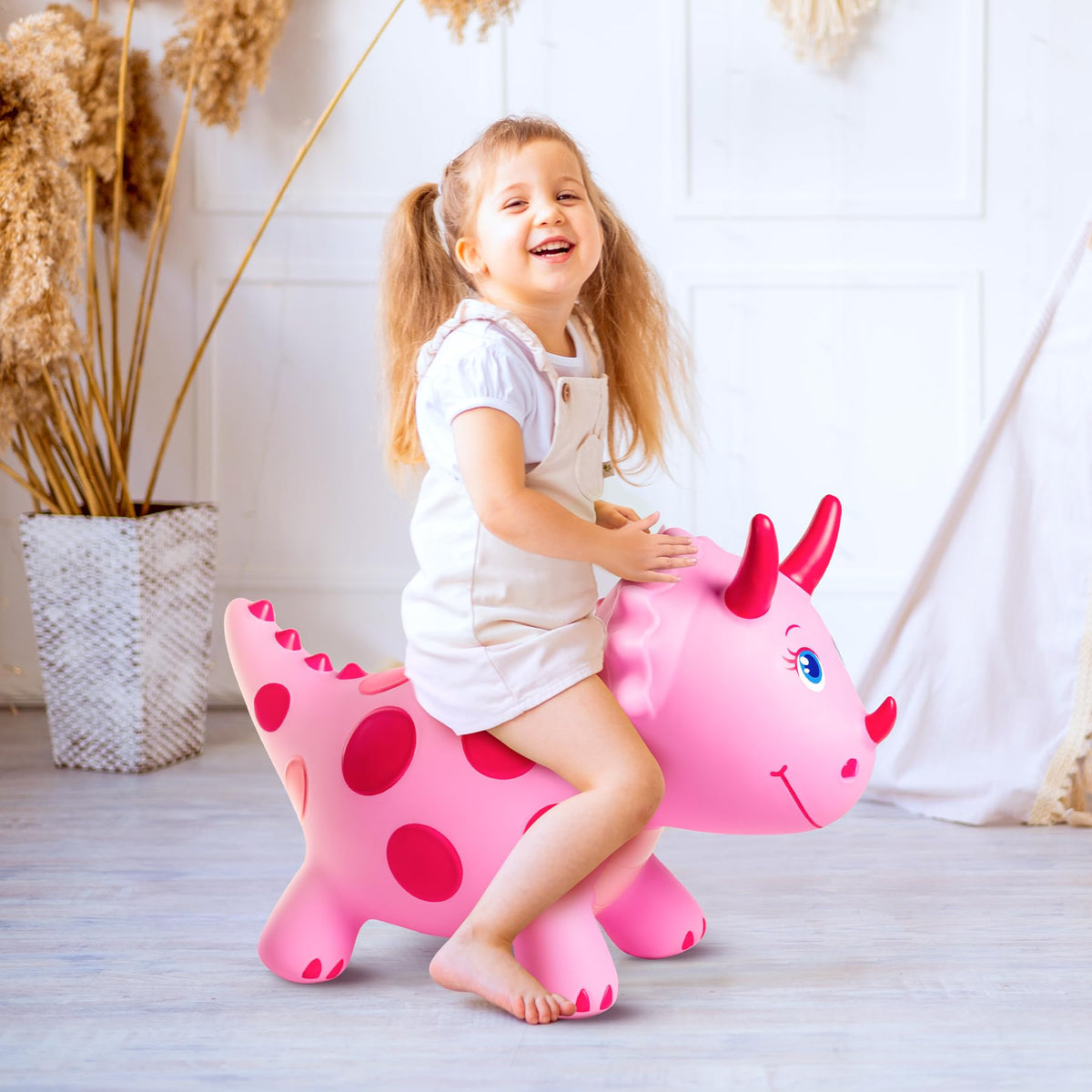 ZOOJOY Dinosaur Bouncy Horse suitable for ages 18 months and up in pink.